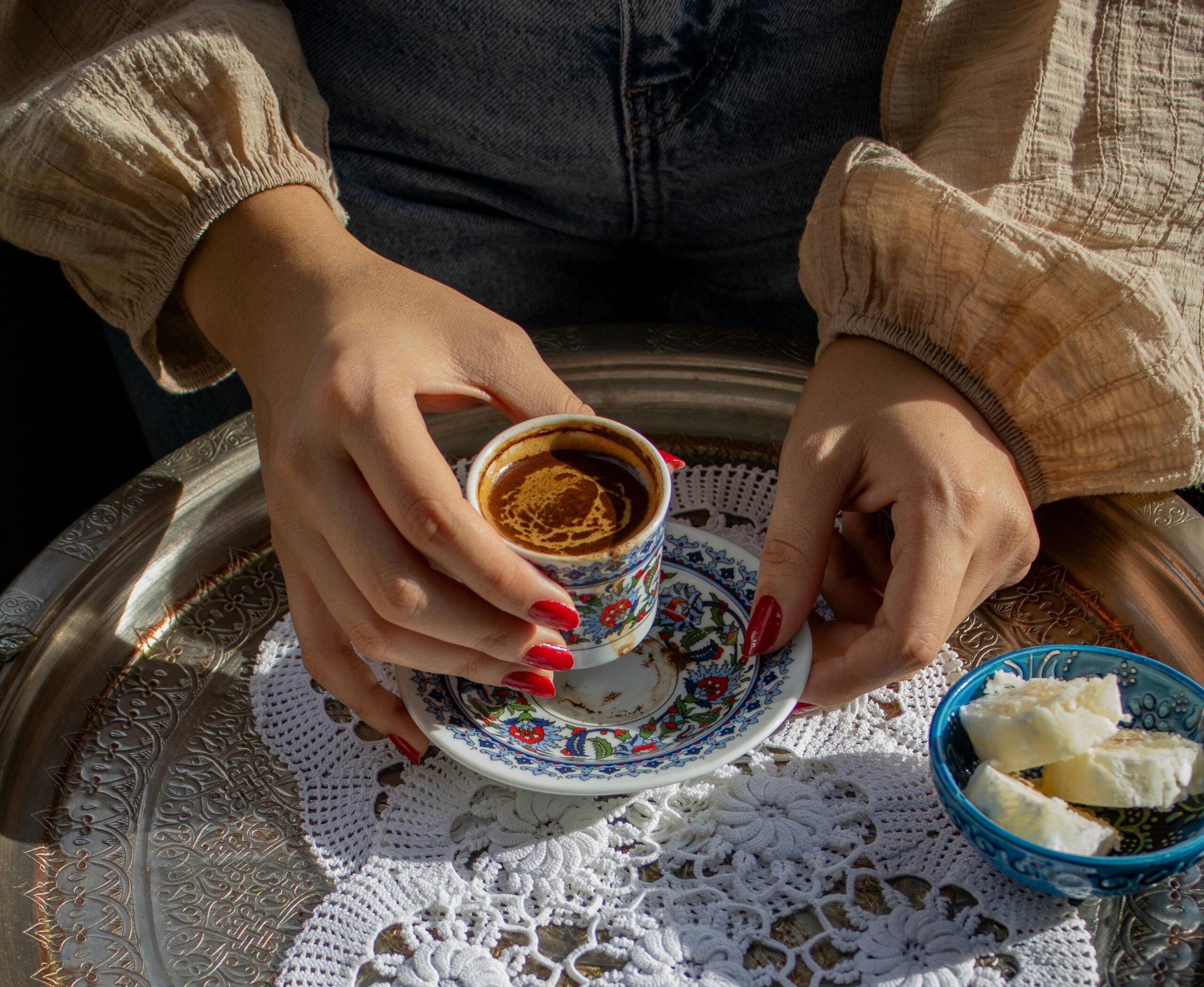 Elegant display of Turkish coffee with Turkish delight on a silver tray, highlighting traditional Turkish culture.